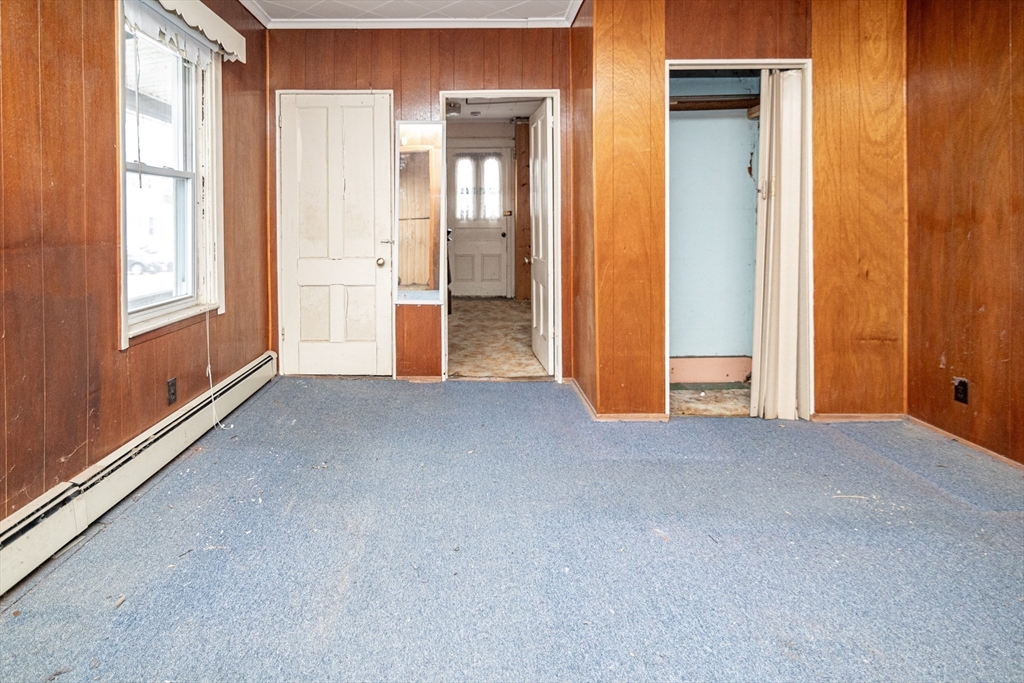 21 Park Street Webster, MA 01570 - Photo 10 of 38 a view of empty room with windows and wardrobe