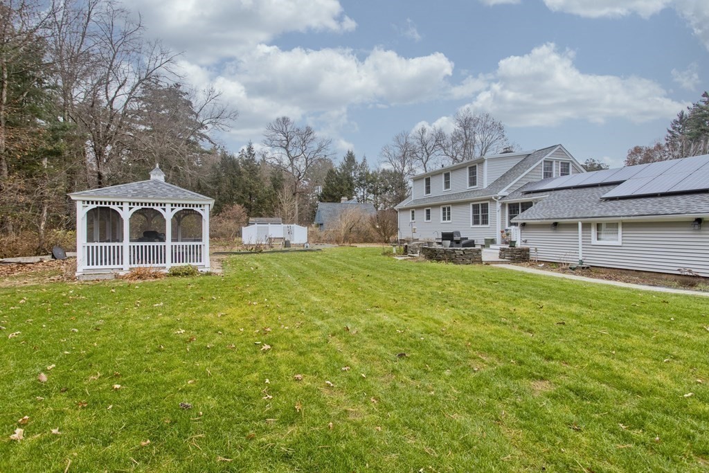 6 West Colonial Road Wilbraham, MA 01095 - Photo 3 of 34 a front view of a house with a garden