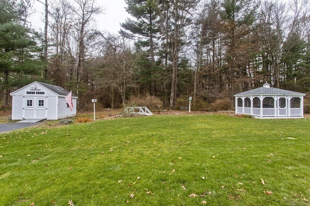 6 West Colonial Road Wilbraham, MA 01095 - Photo 4 of 34 a front view of a house with garden