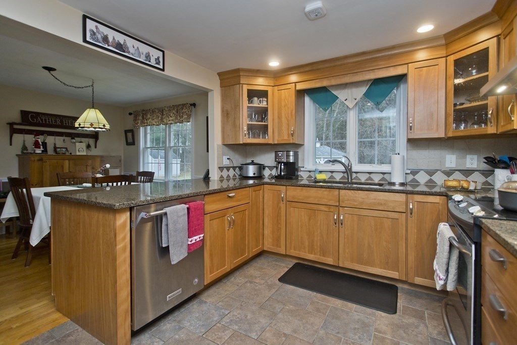 6 West Colonial Road Wilbraham, MA 01095 - Photo 9 of 34 a kitchen with stainless steel appliances granite countertop a stove a sink and a microwave
