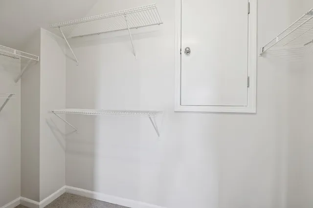 a view of an empty walk in closet