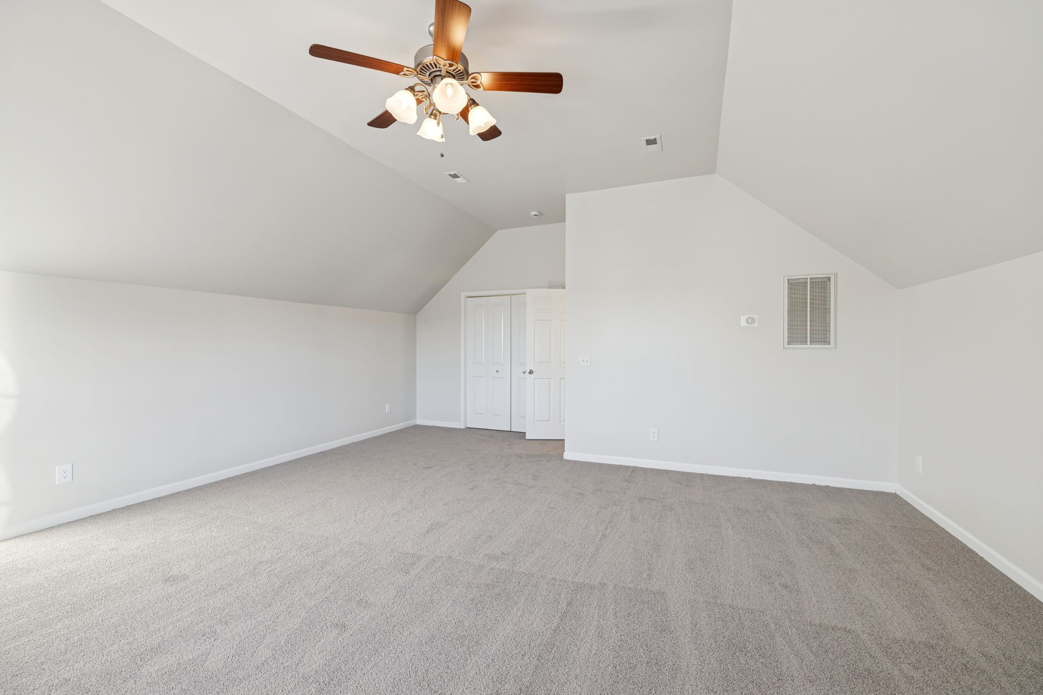 8010 Tiger Court Spring Hill, TN 37174 - Photo 15 of 36 a view of an empty room with a chandelier fan