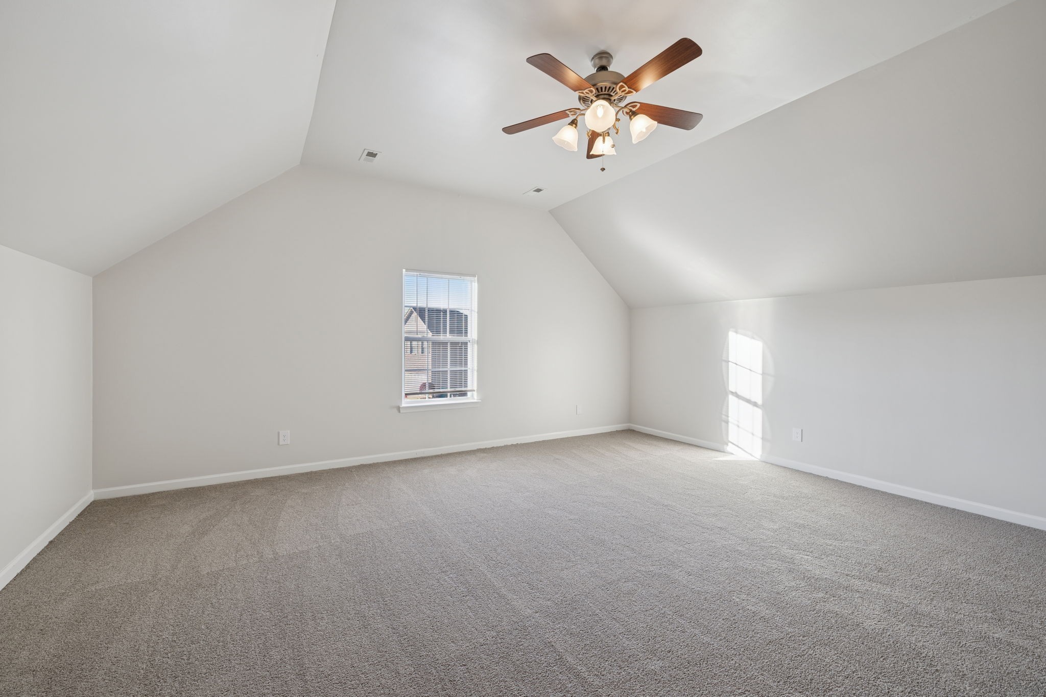 8010 Tiger Court Spring Hill, TN 37174 - Photo 16 of 36 an empty room with a window and a ceiling fan