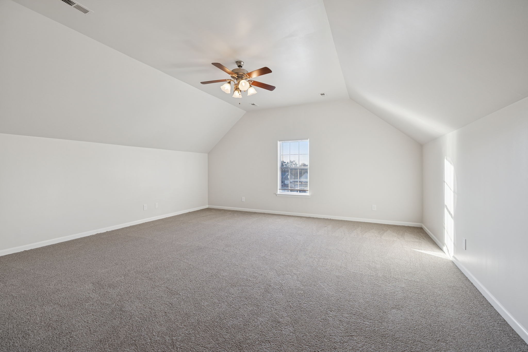 8010 Tiger Court Spring Hill, TN 37174 - Photo 17 of 36 an empty room with windows and ceiling fan view