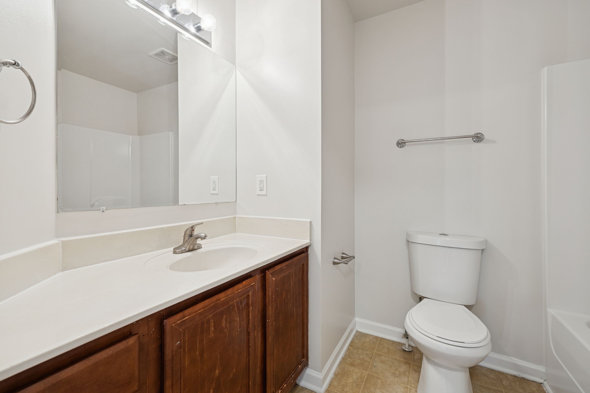 8010 Tiger Court Spring Hill, TN 37174 - Photo 21 of 36 a bathroom with a sink a toilet and a mirror