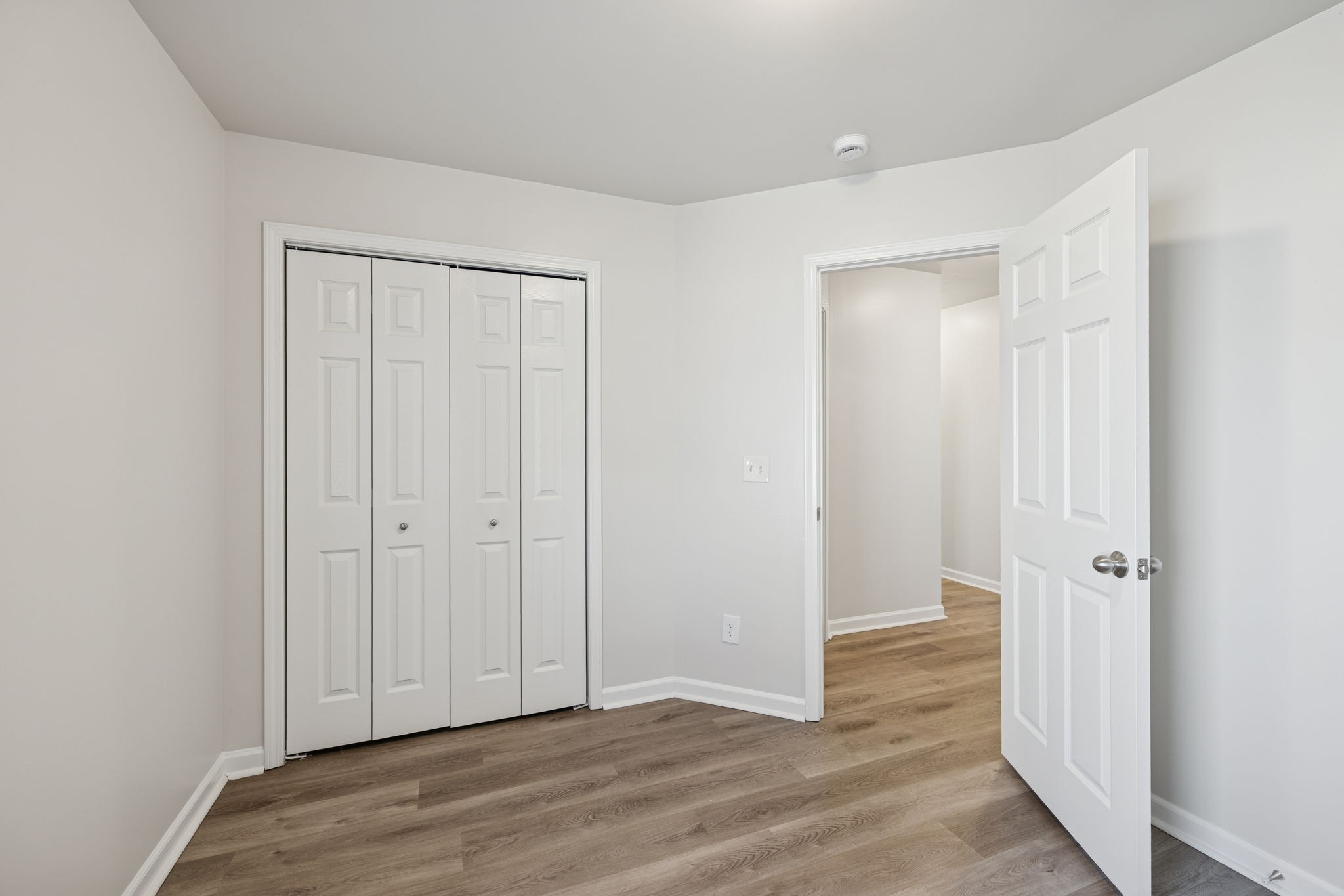 8010 Tiger Court Spring Hill, TN 37174 - Photo 22 of 36 an empty room with wooden floor