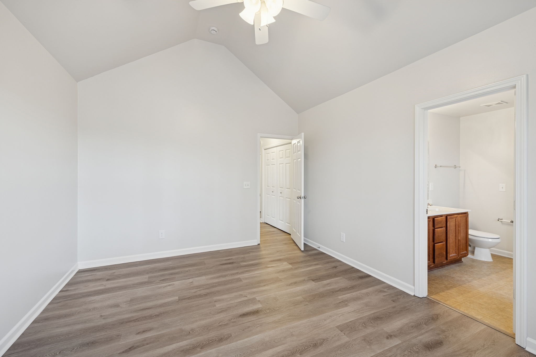 8010 Tiger Court Spring Hill, TN 37174 - Photo 28 of 36 a view of an empty room with wooden floor