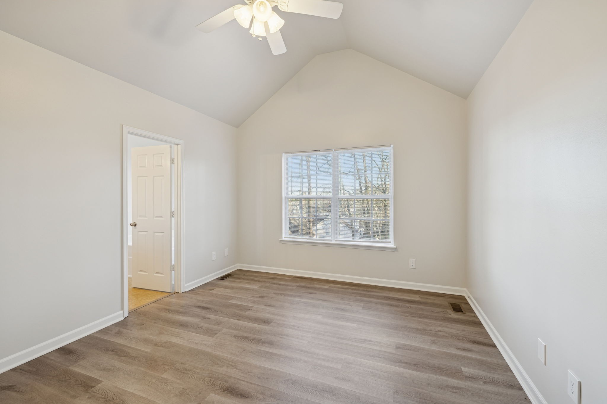 8010 Tiger Court Spring Hill, TN 37174 - Photo 29 of 36 an empty room with wooden floor and windows