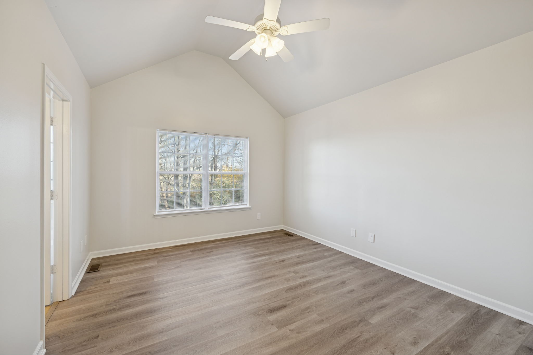8010 Tiger Court Spring Hill, TN 37174 - Photo 30 of 36 wooden floor in an empty room with a window