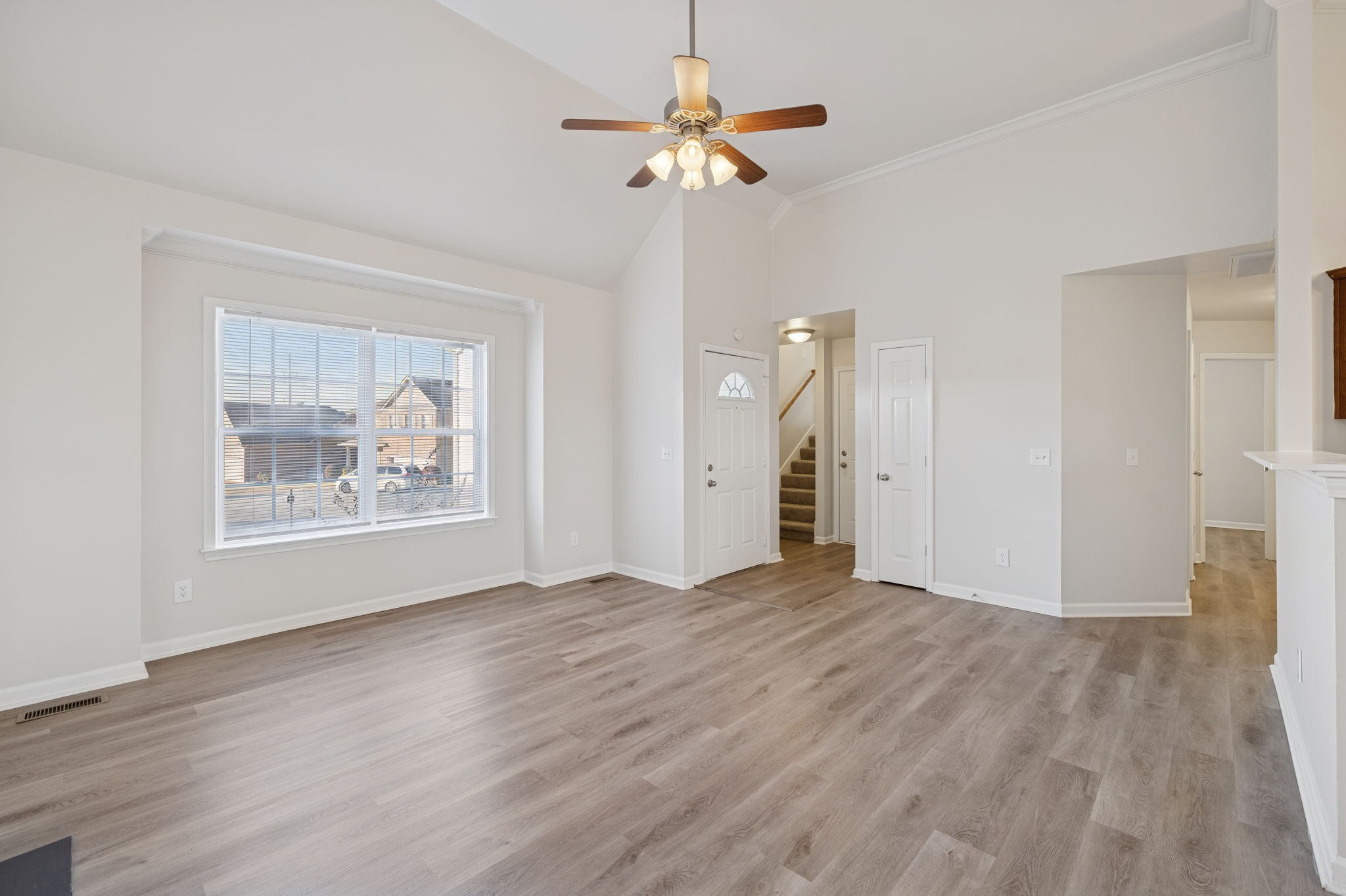 8010 Tiger Court Spring Hill, TN 37174 - Photo 3 of 36 wooden floor in an empty room with a window