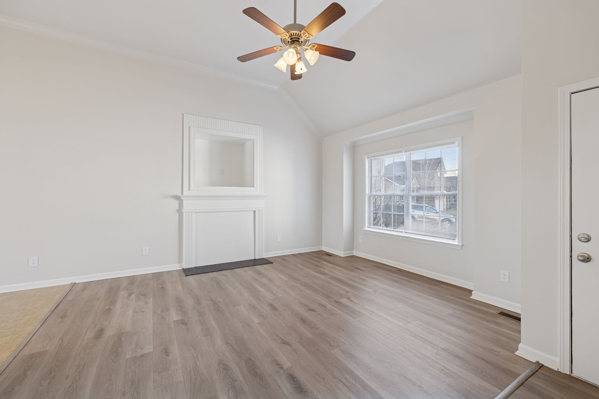 8010 Tiger Court Spring Hill, TN 37174 - Photo 4 of 36 wooden floor in an empty room with a window