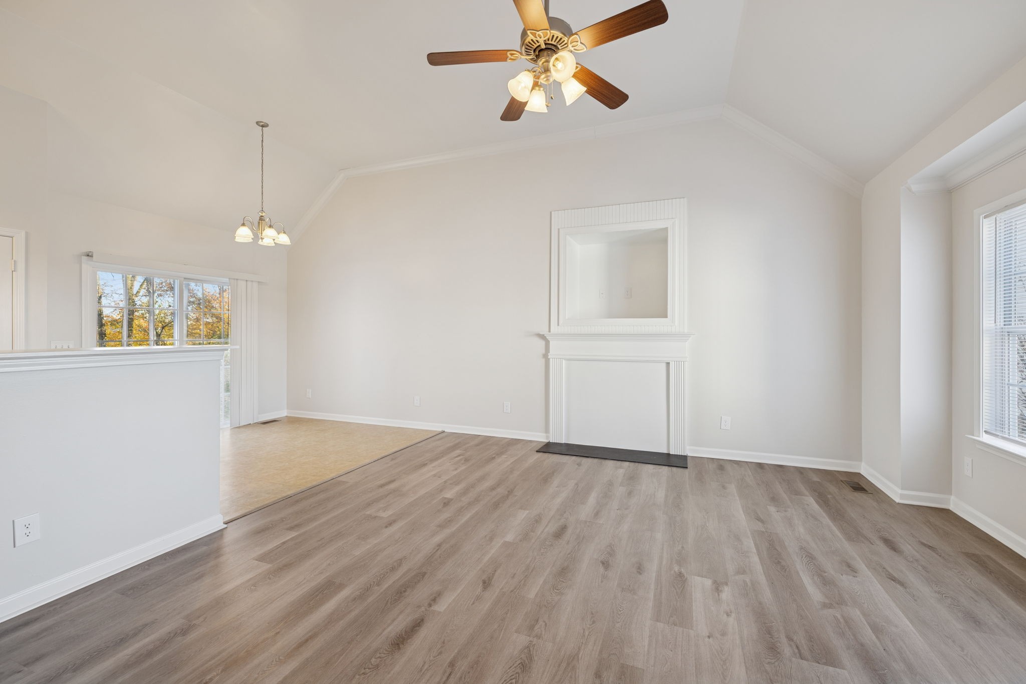 8010 Tiger Court Spring Hill, TN 37174 - Photo 5 of 36 an empty room with wooden floor and windows