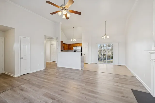 a view of a kitchen with a dishwasher cabinets and wooden floor