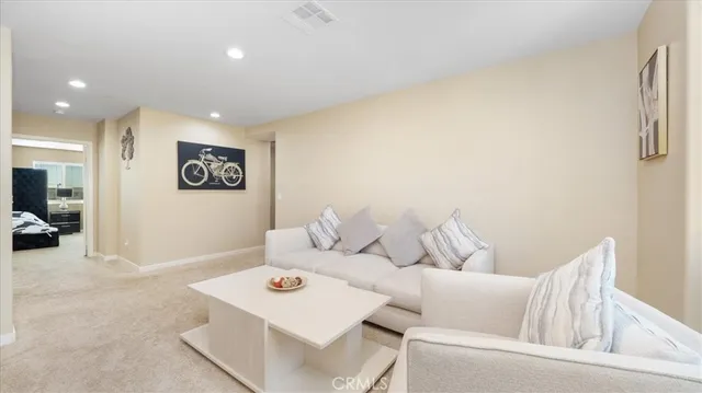 a living room with furniture and a table