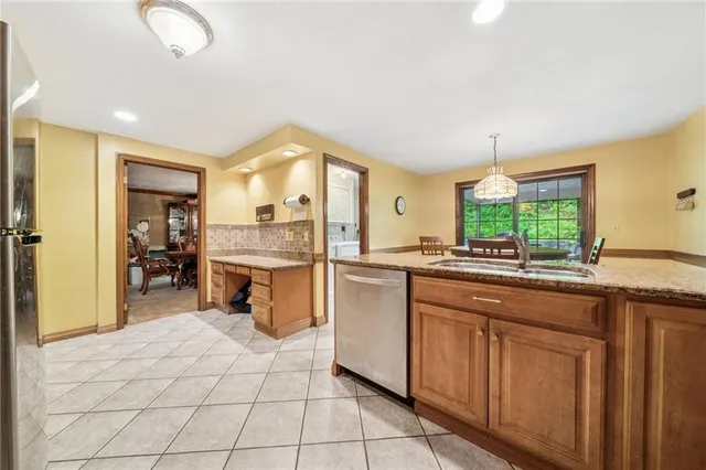 a kitchen with a sink cabinets and window