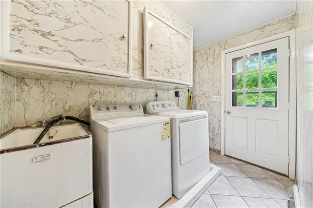 a utility room with dryer and washer