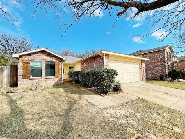 a view of a house with a snow in the yard