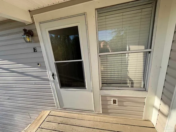 a view of a balcony with a door