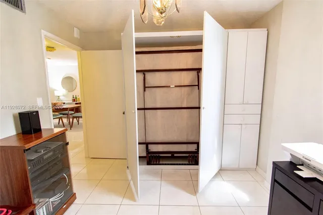 a kitchen with stainless steel appliances a refrigerator and cabinets