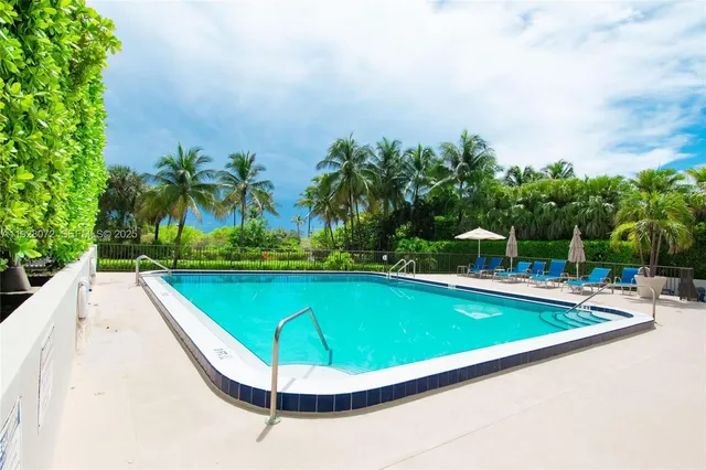 a view of a swimming pool with lounge chair