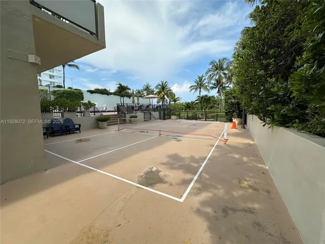 an outdoor space with lots of trees in the background
