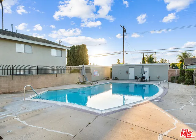 a view of a swimming pool with a lounge chairs