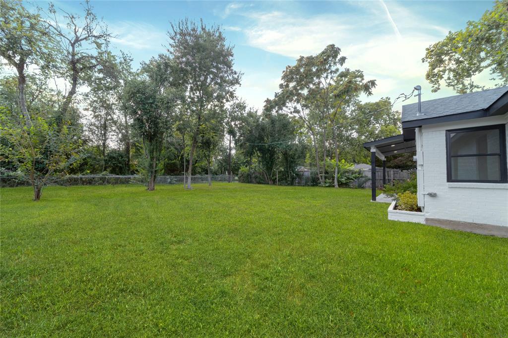932 Treasure Road Garland, TX 75041 - Photo 28 of 28 View of yard featuring view of scattered trees