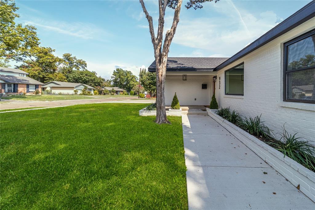 932 Treasure Road Garland, TX 75041 - Photo 3 of 28 View of green lawn with covered porch and a residential view