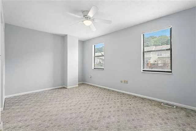 a view of an empty room with a window