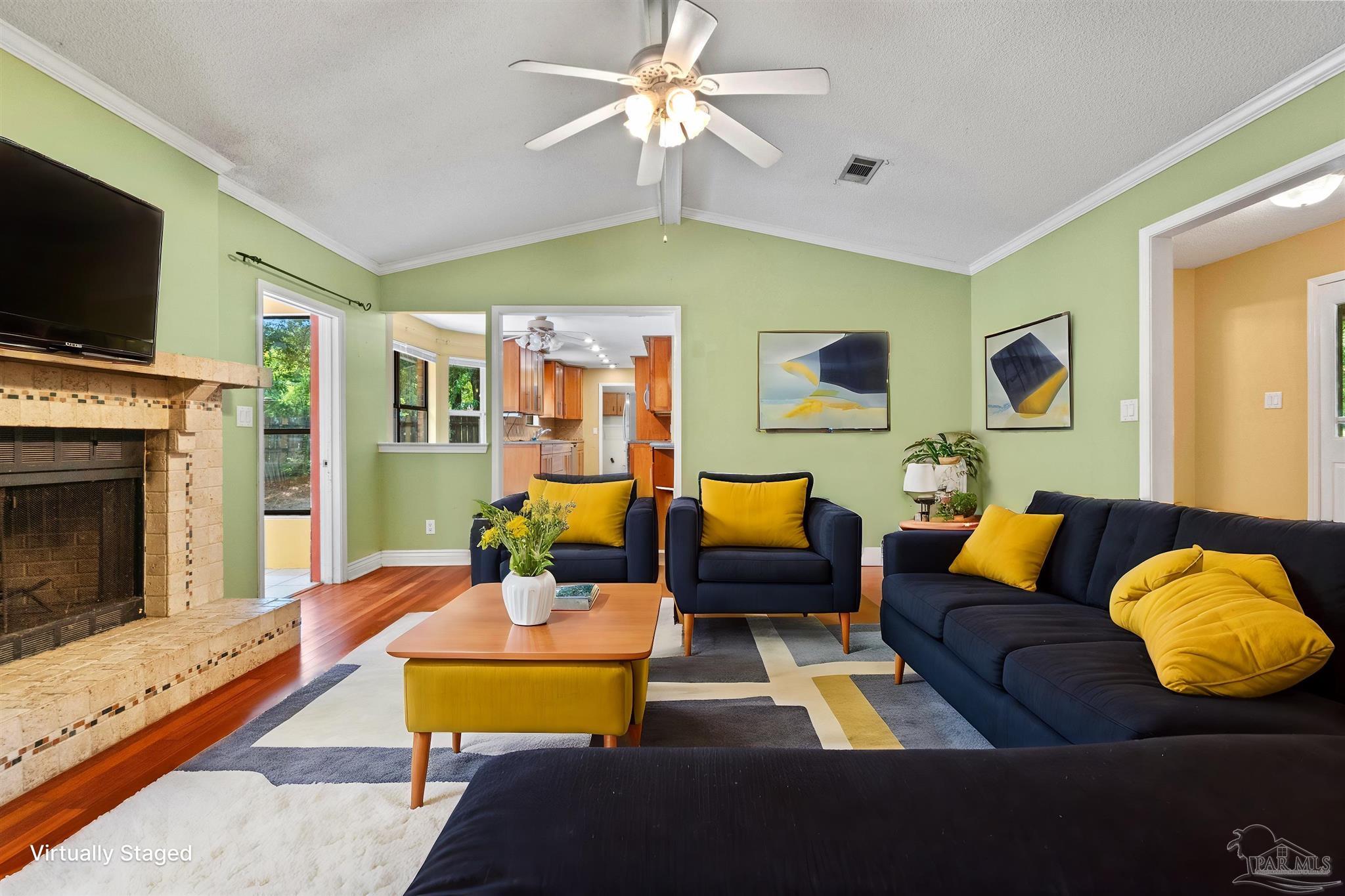1151 Stone Bridge Road Pensacola, FL 32514 - Photo 1 of 52 a living room with furniture fireplace and flat screen tv