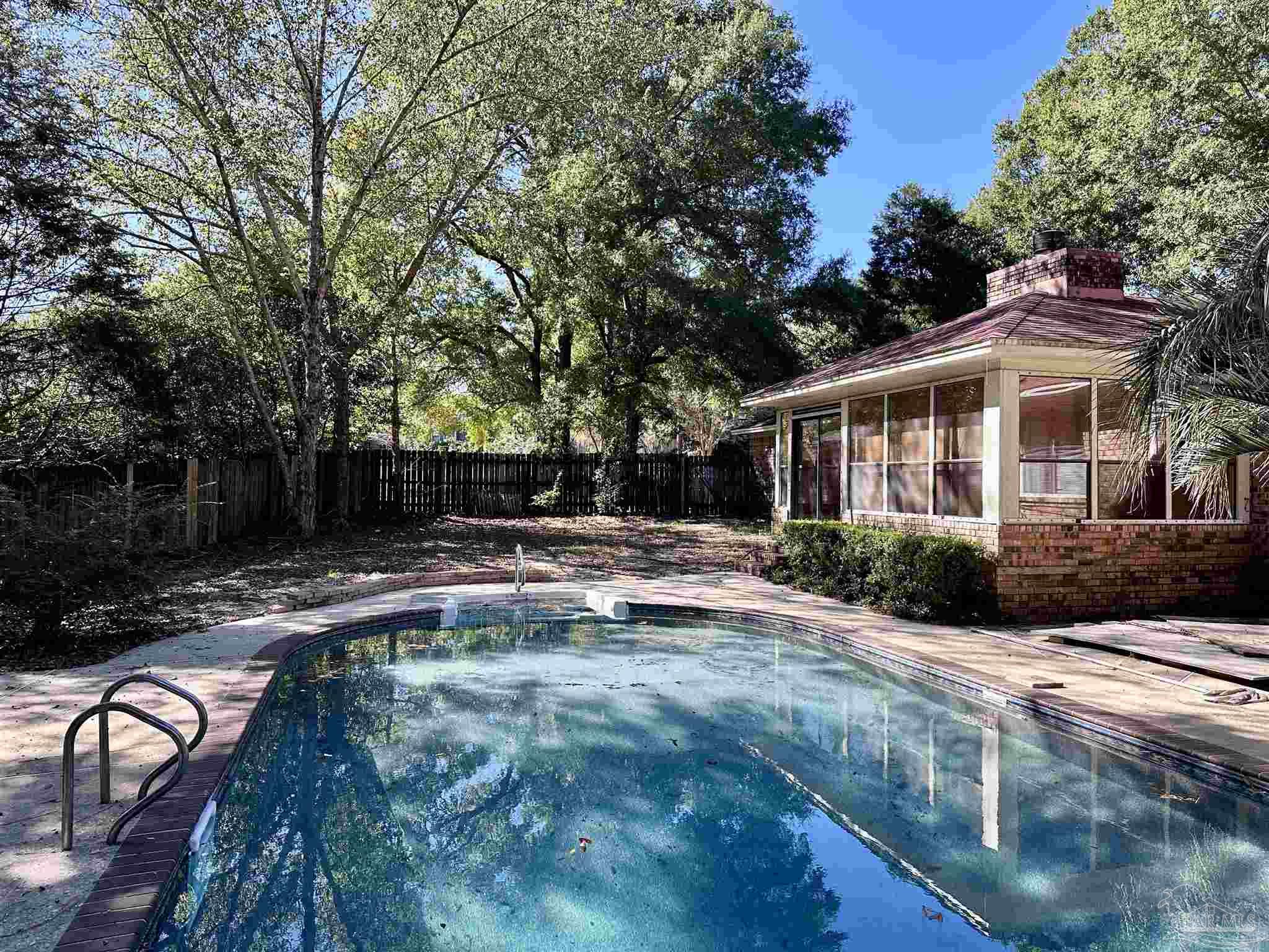 1151 Stone Bridge Road Pensacola, FL 32514 - Photo 2 of 52 a view of a house with backyard and sitting area