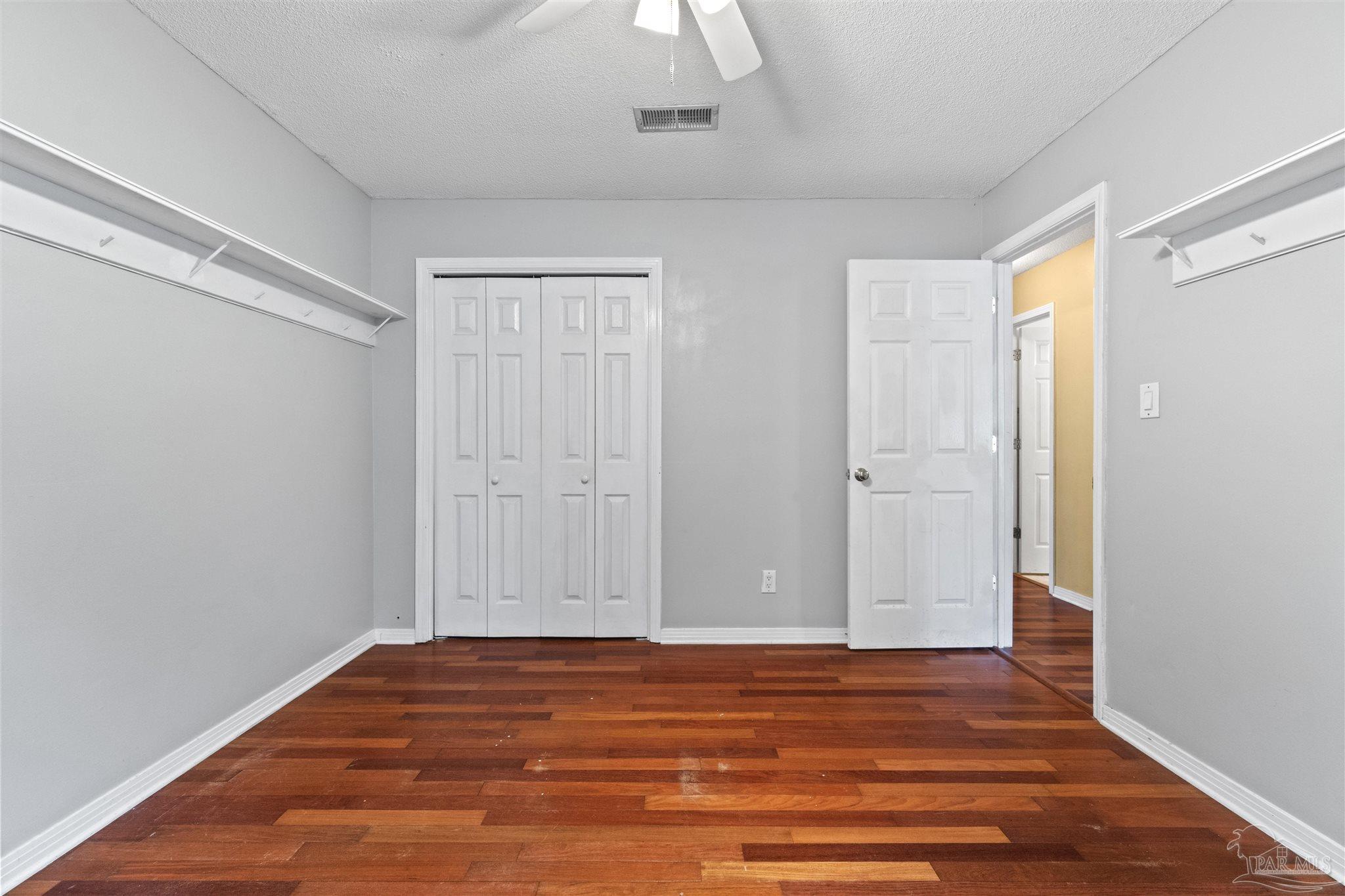 1151 Stone Bridge Road Pensacola, FL 32514 - Photo 30 of 52 a view of room with wooden floor