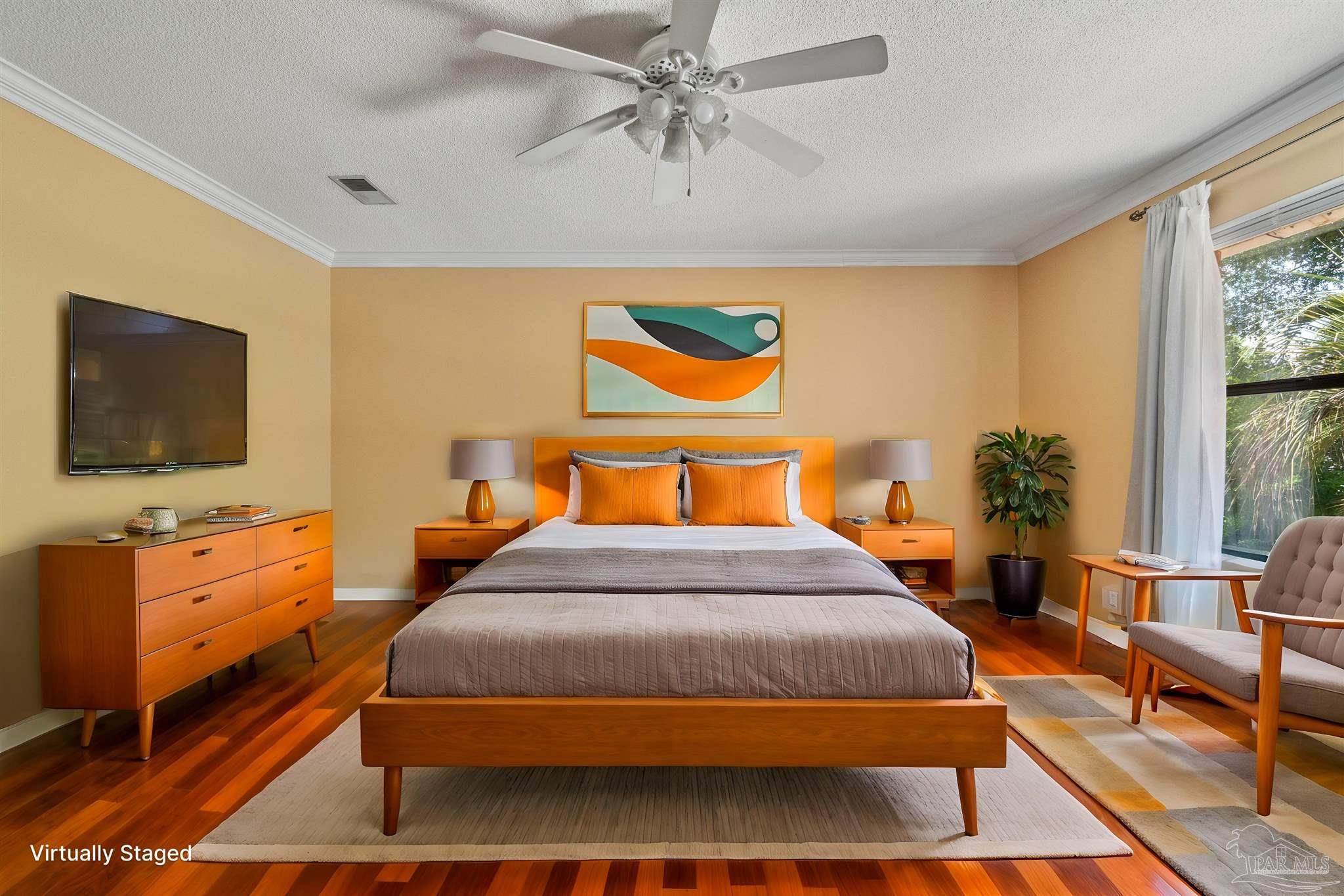 1151 Stone Bridge Road Pensacola, FL 32514 - Photo 3 of 52 a bedroom with a bed and dresser with mirror