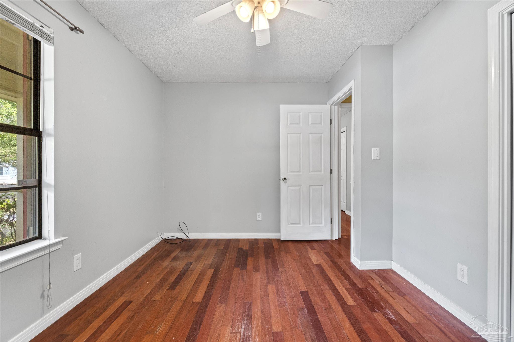 1151 Stone Bridge Road Pensacola, FL 32514 - Photo 32 of 52 a view of a room with wooden floor and a window