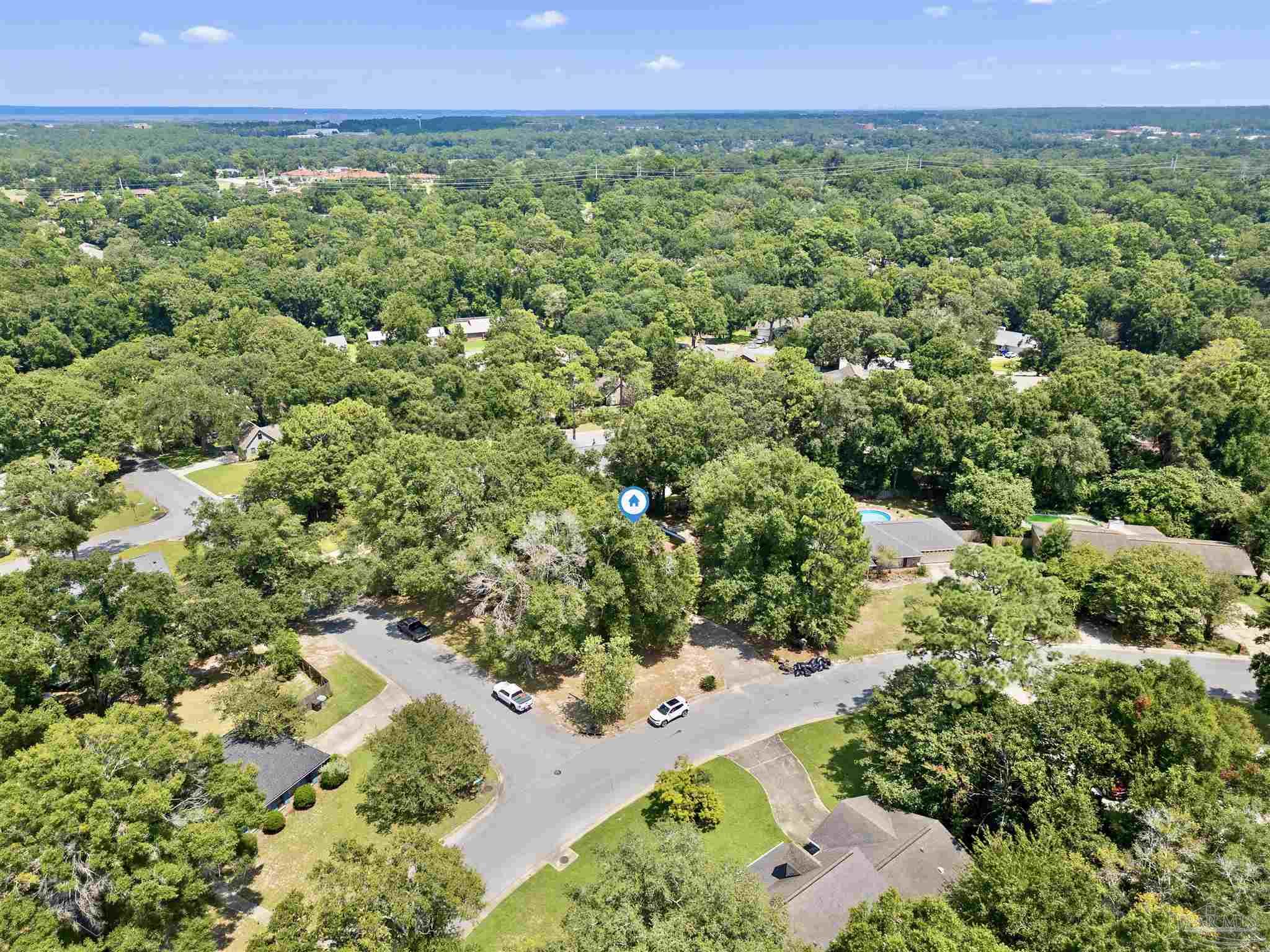 1151 Stone Bridge Road Pensacola, FL 32514 - Photo 40 of 52 a view of a lush green field with lots of plants in it