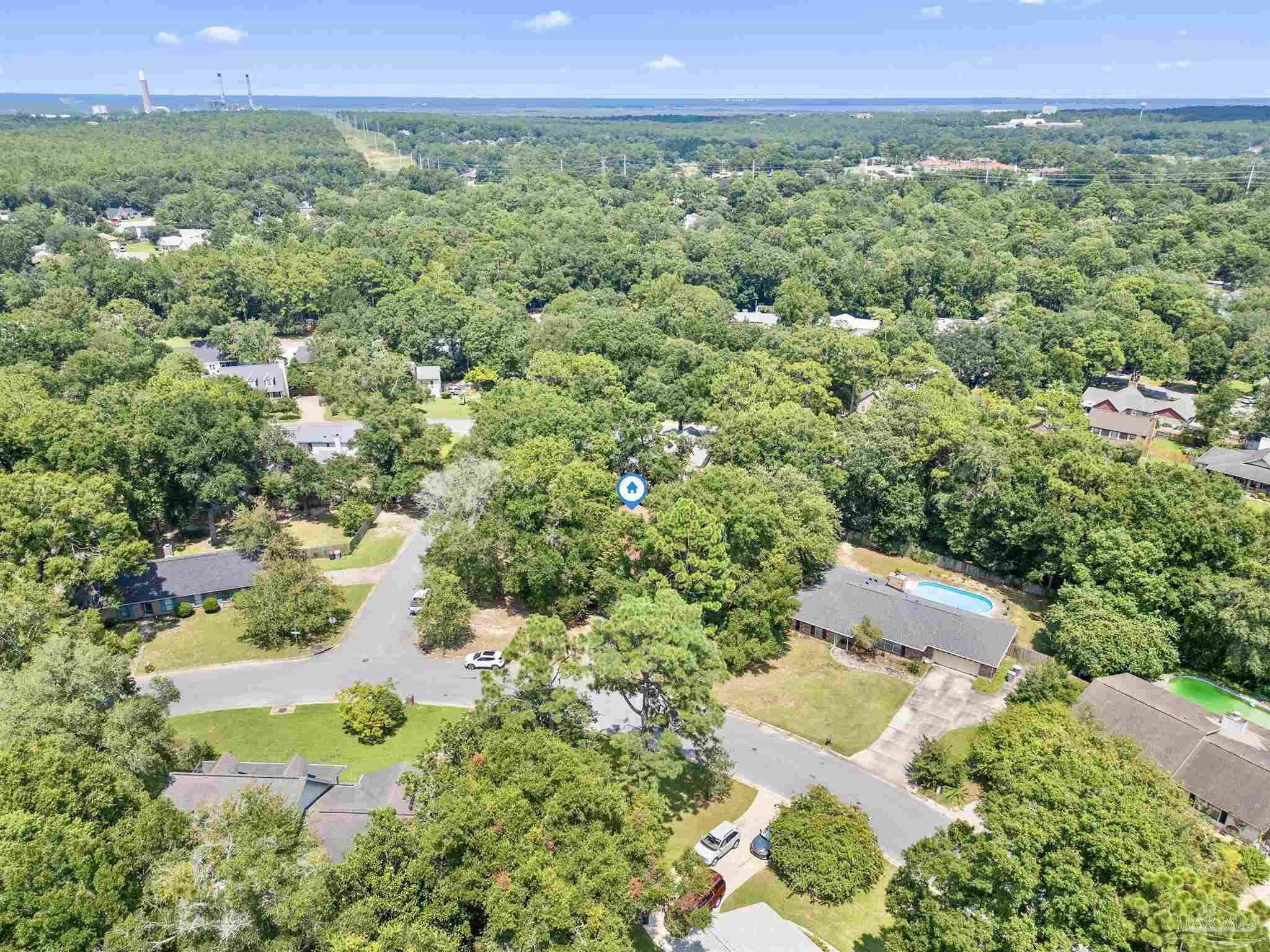 1151 Stone Bridge Road Pensacola, FL 32514 - Photo 42 of 52 a view of a green yard with an trees