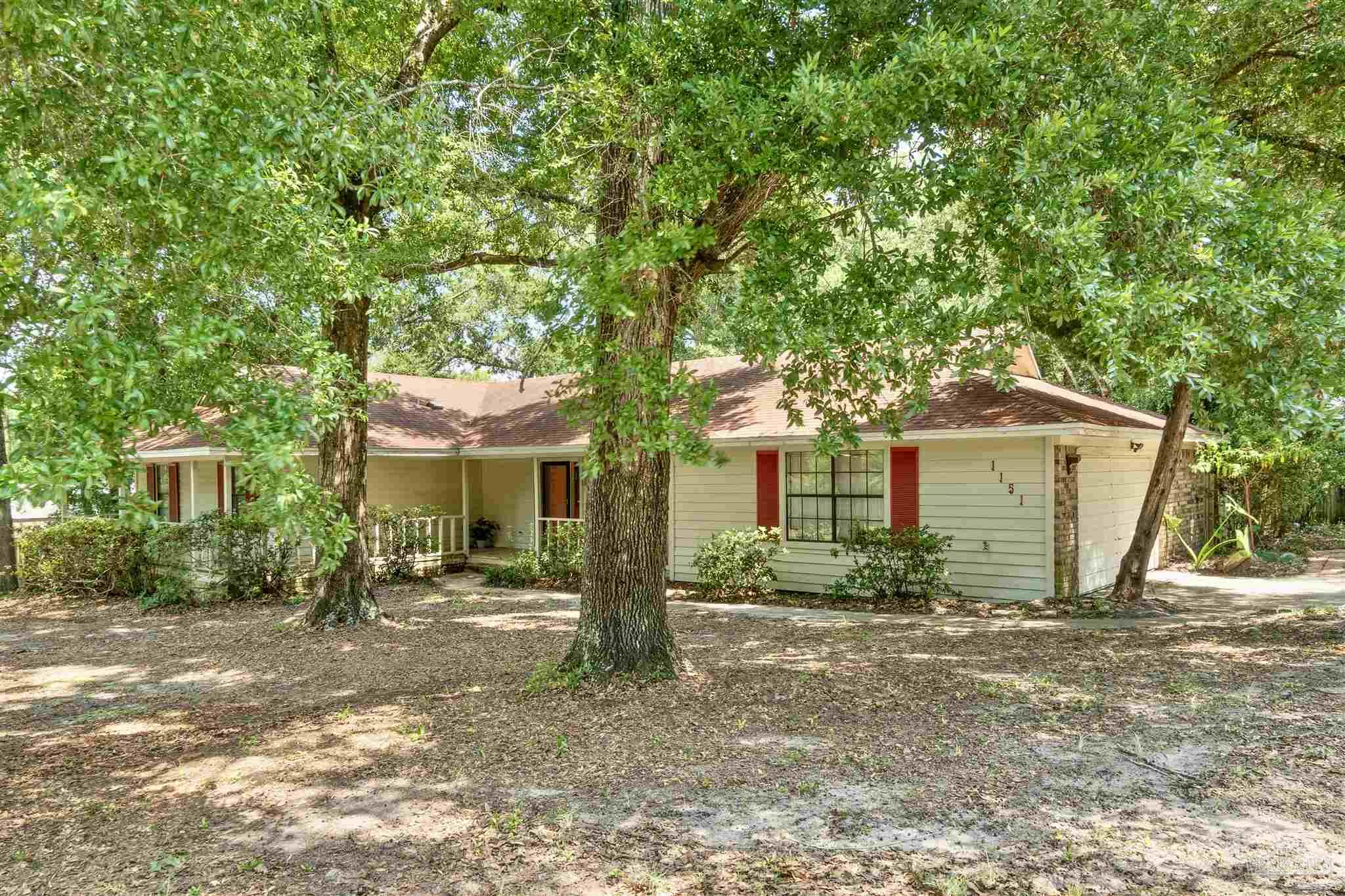 1151 Stone Bridge Road Pensacola, FL 32514 - Photo 50 of 52 a front view of a house with garden