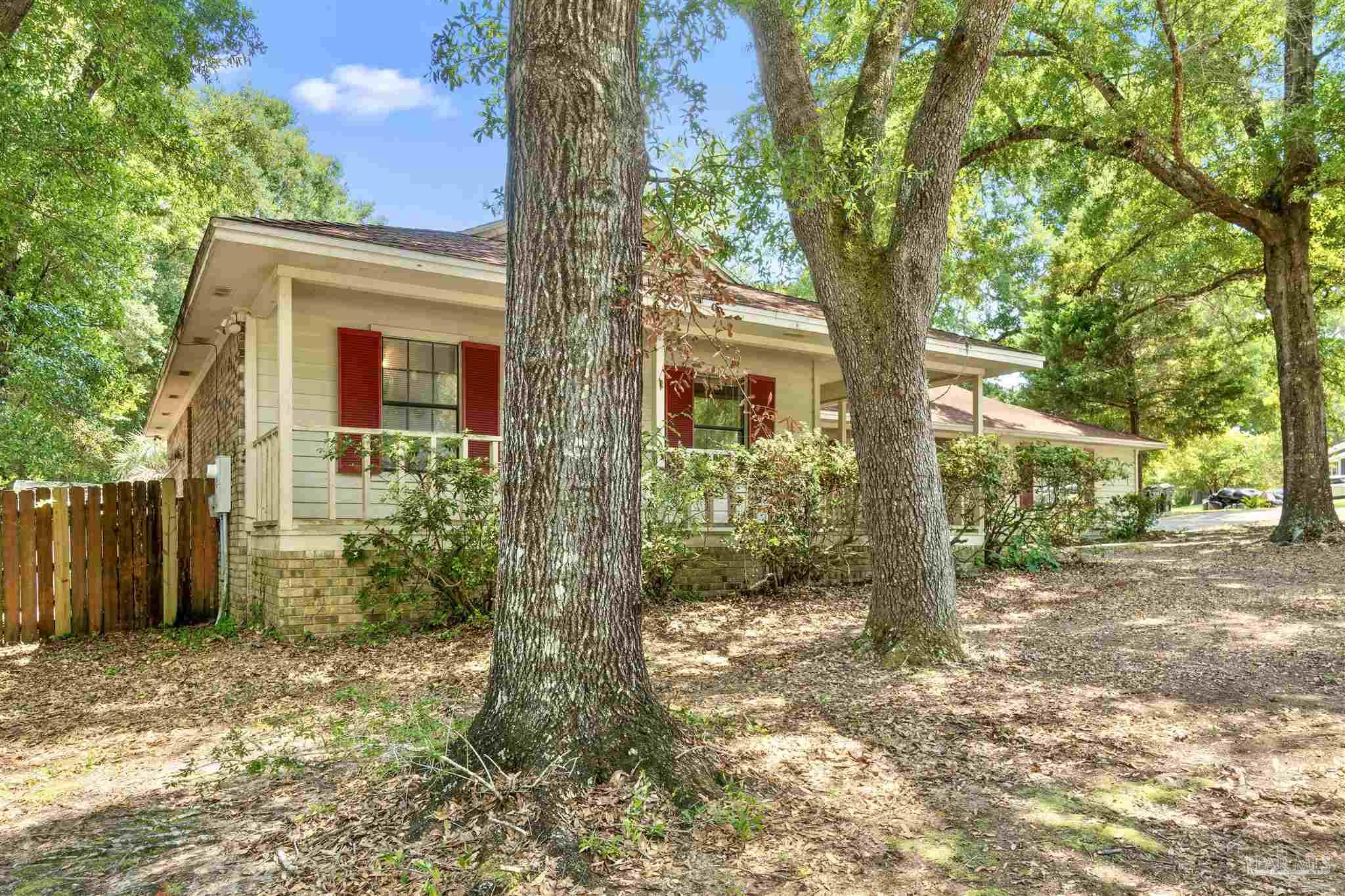 1151 Stone Bridge Road Pensacola, FL 32514 - Photo 51 of 52 a view of a house with a tree in the yard