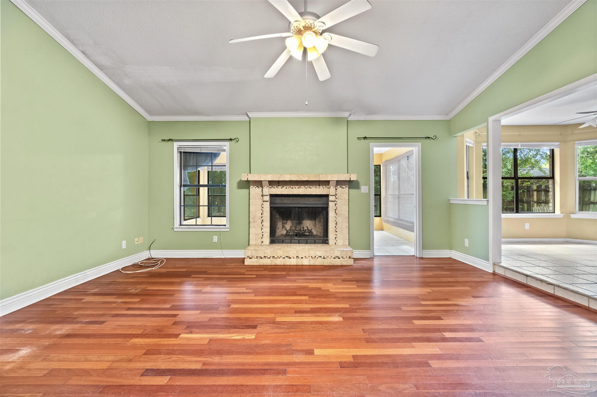 1151 Stone Bridge Road Pensacola, FL 32514 - Photo 10 of 52 a view of an empty room with window and chandelier fan