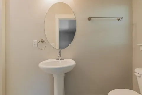 a bathroom with a sink and mirror