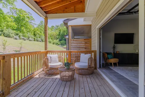 a view of a balcony with chairs