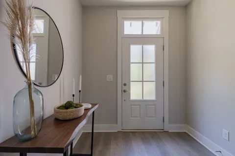 a view of a livingroom with furniture and a window
