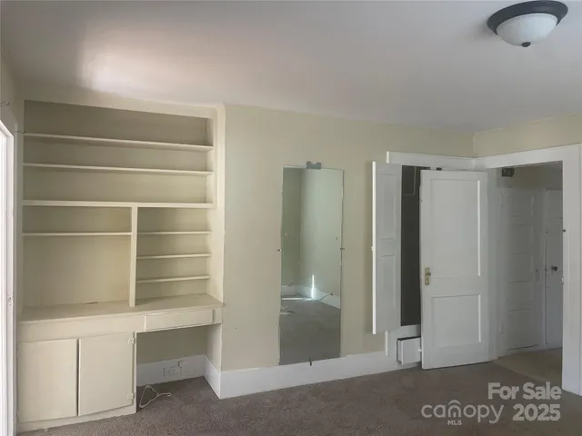 an empty room with windows