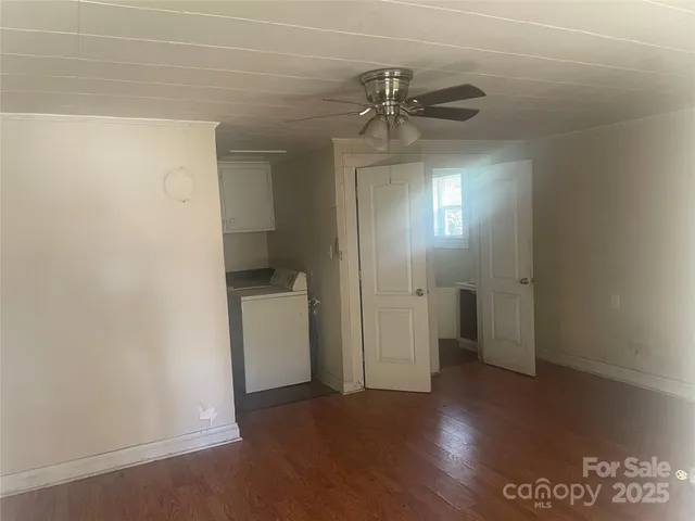 a view of a bathroom from a hallway