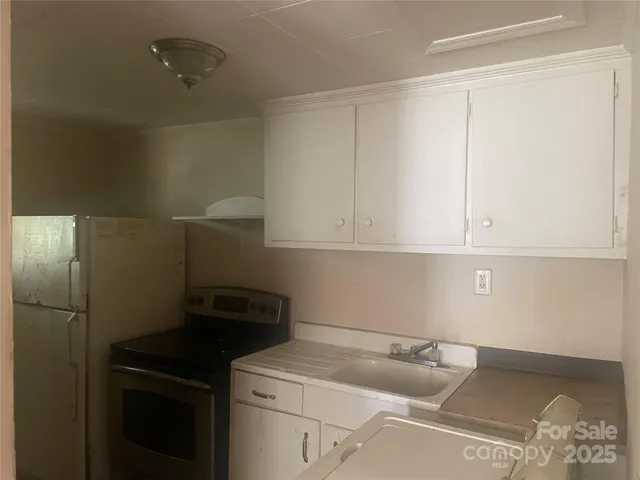 a white toilet sitting next to a window