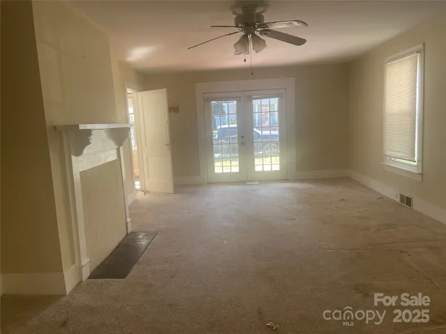 a kitchen with a refrigerator and cabinets