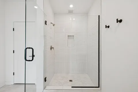 a bedroom with a bed and a potted plant