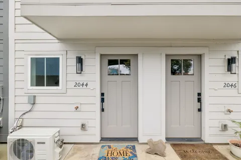 a view of room with walk in closet and wooden floor