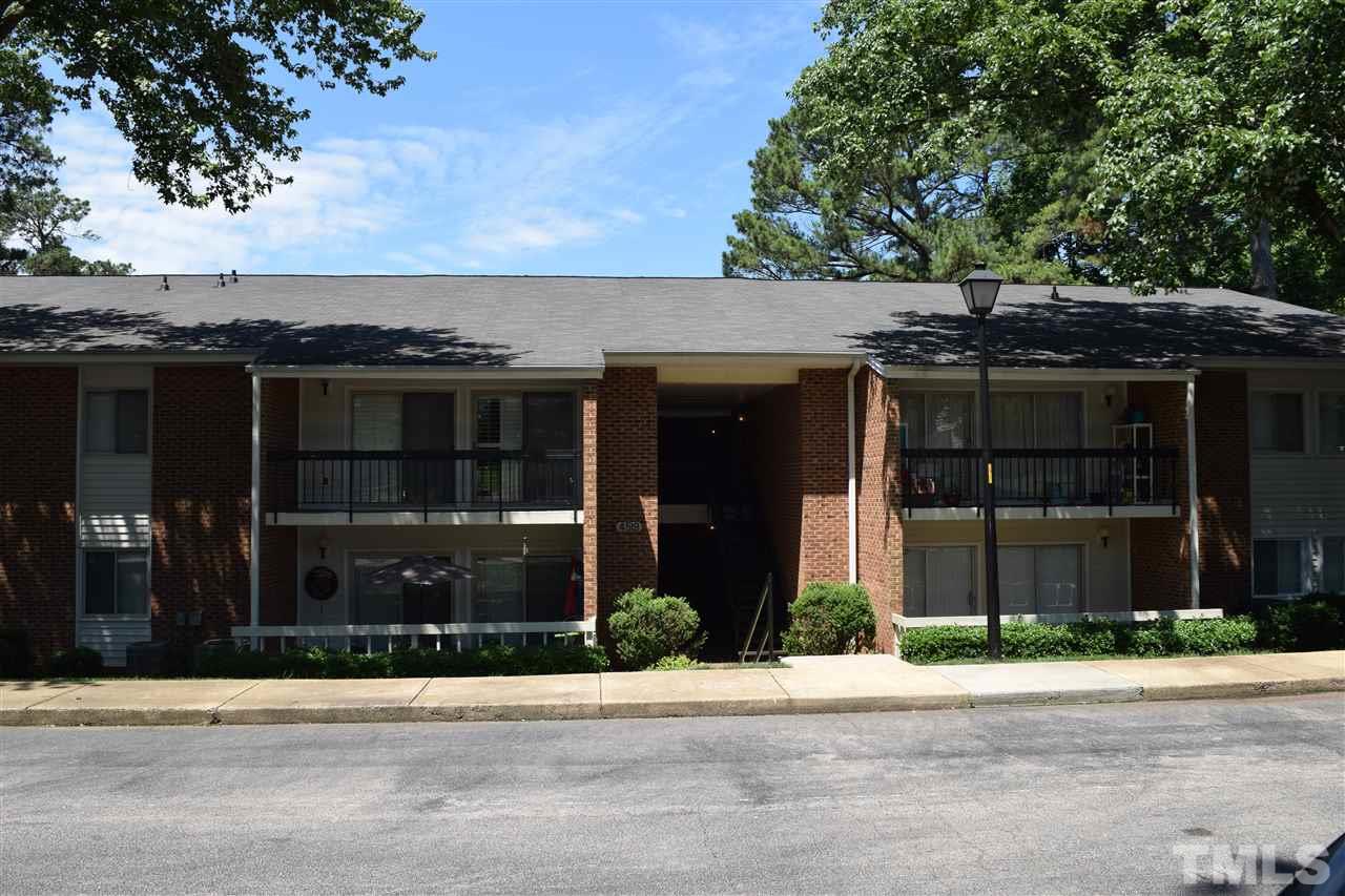4519 Edwards Mill Road, Unit F Raleigh, NC 27612 - Photo 1 of 14 a front view of a house with a garden