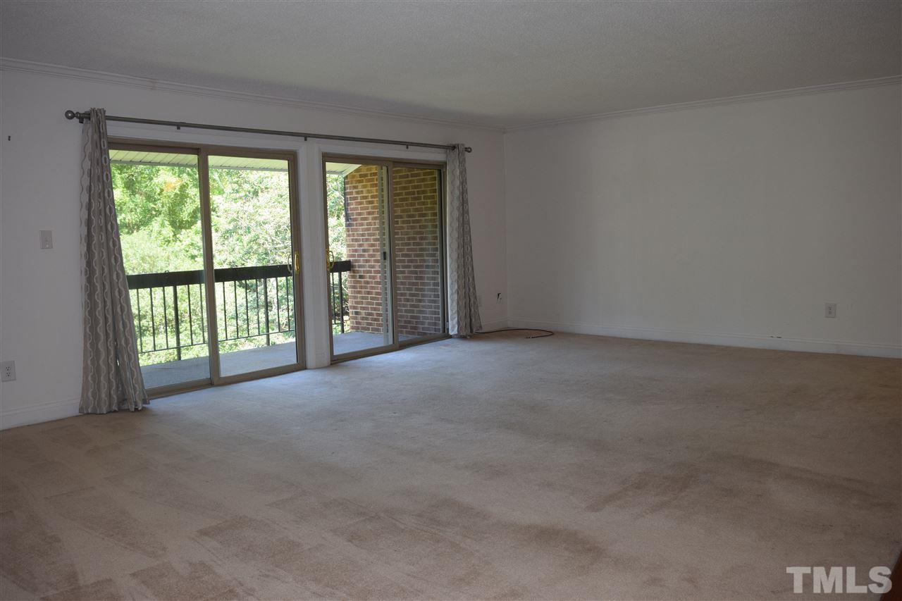 4519 Edwards Mill Road, Unit F Raleigh, NC 27612 - Photo 3 of 14 a view of a big room with large windows
